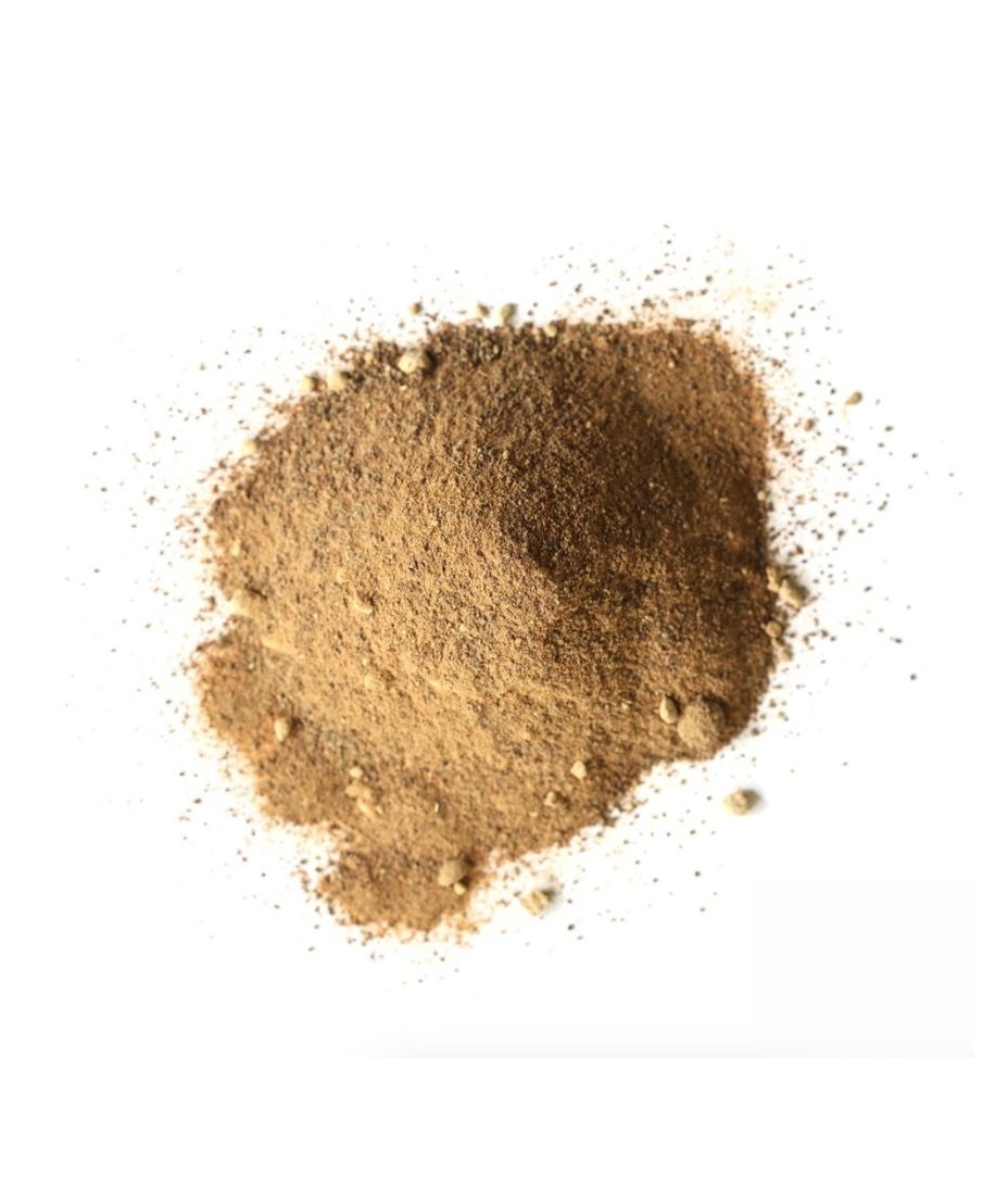 Fine brown amla powder on a white background, representing natural Vitamin C and antioxidant-rich superfood benefits.
