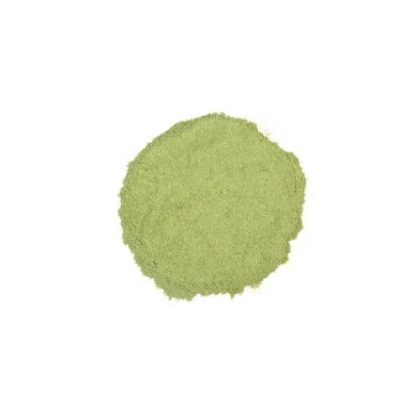 Finely milled alfalfa leaf powder in light green color on a white background.