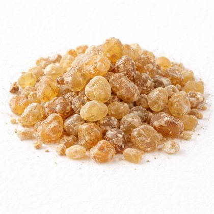 Pile of boswellia serrata resin tears on white textured background