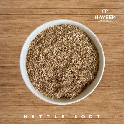 A bowl of dried nettle root pieces on a wooden surface with the Naveen Apothecary logo.