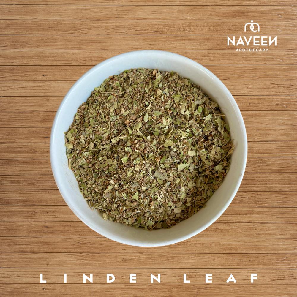 A bowl of dried linden leaf pieces on a wooden surface with the Naveen Apothecary logo.