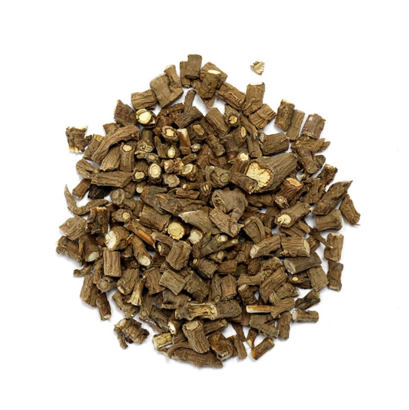 Pile of dried bupleurum root from Naveen Herbs on a white background