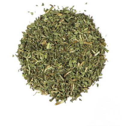 Pile of dried dandelion leaf pieces on white textured background