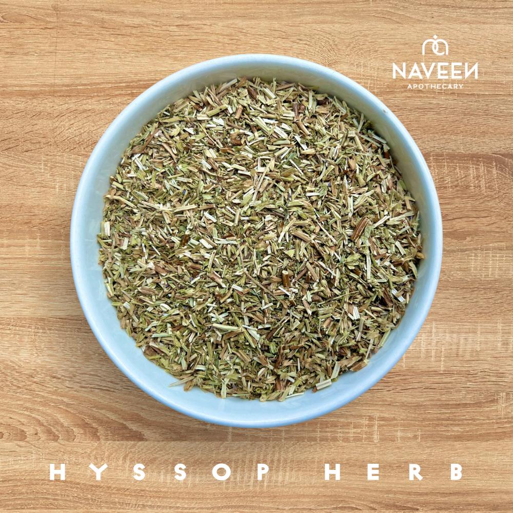 A bowl of dried hyssop herb on a wooden surface with the Naveen Apothecary logo.