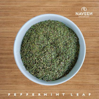 A bowl of dried peppermint leaf on a wooden surface with the Naveen Apothecary logo.