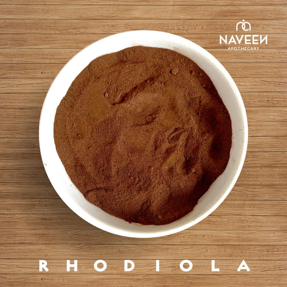 A bowl filled with fine brown rhodiola powder on a wooden surface with the Naveen Apothecary logo.
