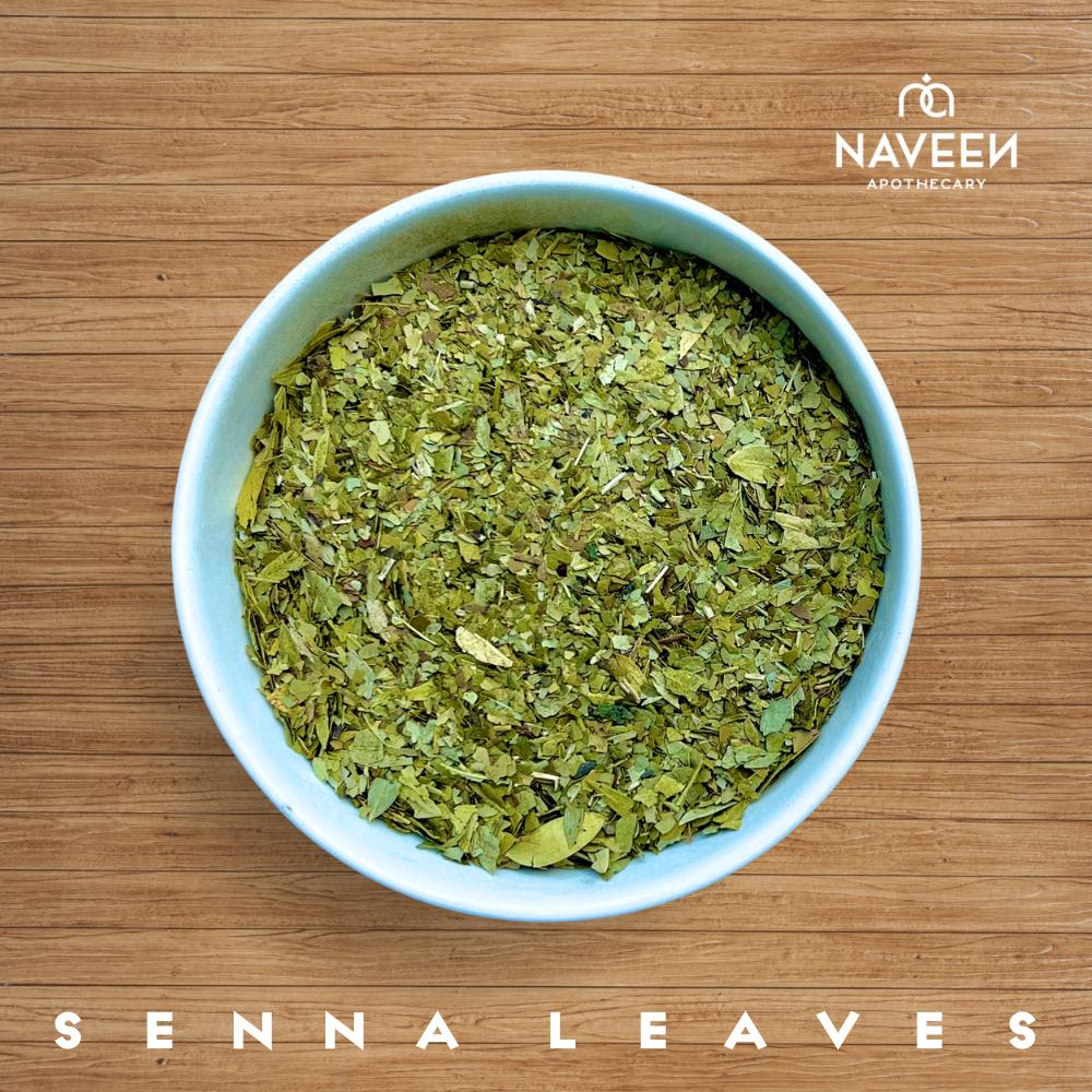 A bowl of dried senna leaves on a wooden surface with the Naveen Apothecary logo.