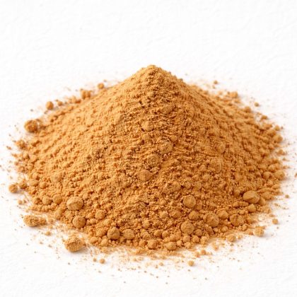 Pile of yellow dock root powder on white textured background