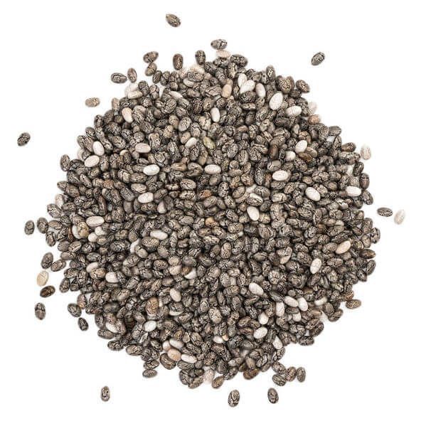 Pile of chia seeds from Naveen Herbs on a white background
