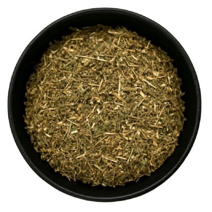 Pile of dried chickweed herb from Naveen Herbs on a white background