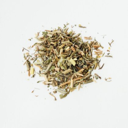 Pile of dried cleavers herb from Naveen Herbs on a white background