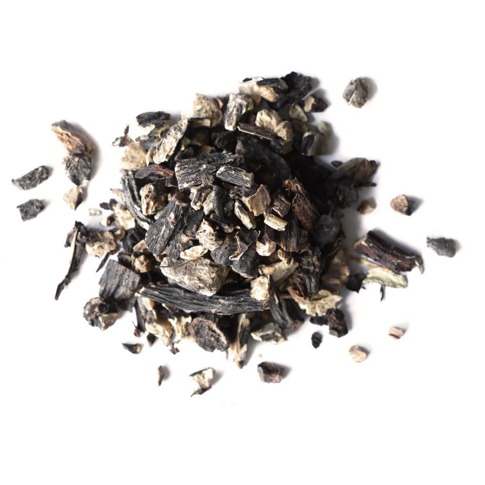 Pile of dried comfrey root from Naveen Herbs on a white background