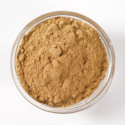Pile of devil’s claw root powder from Naveen Herbs on a white background