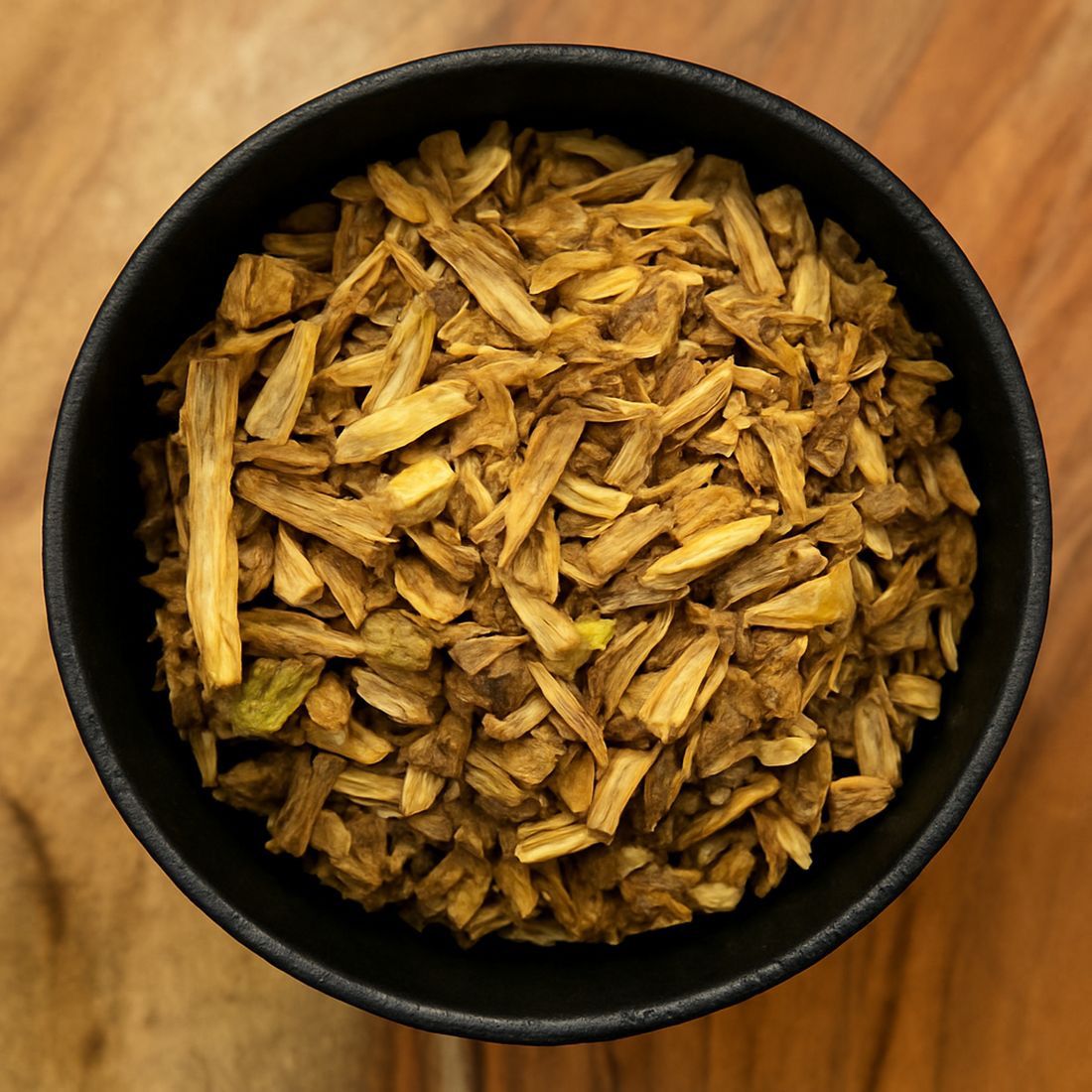 Pile of dried devil’s club root bark from Naveen Herbs on a white background