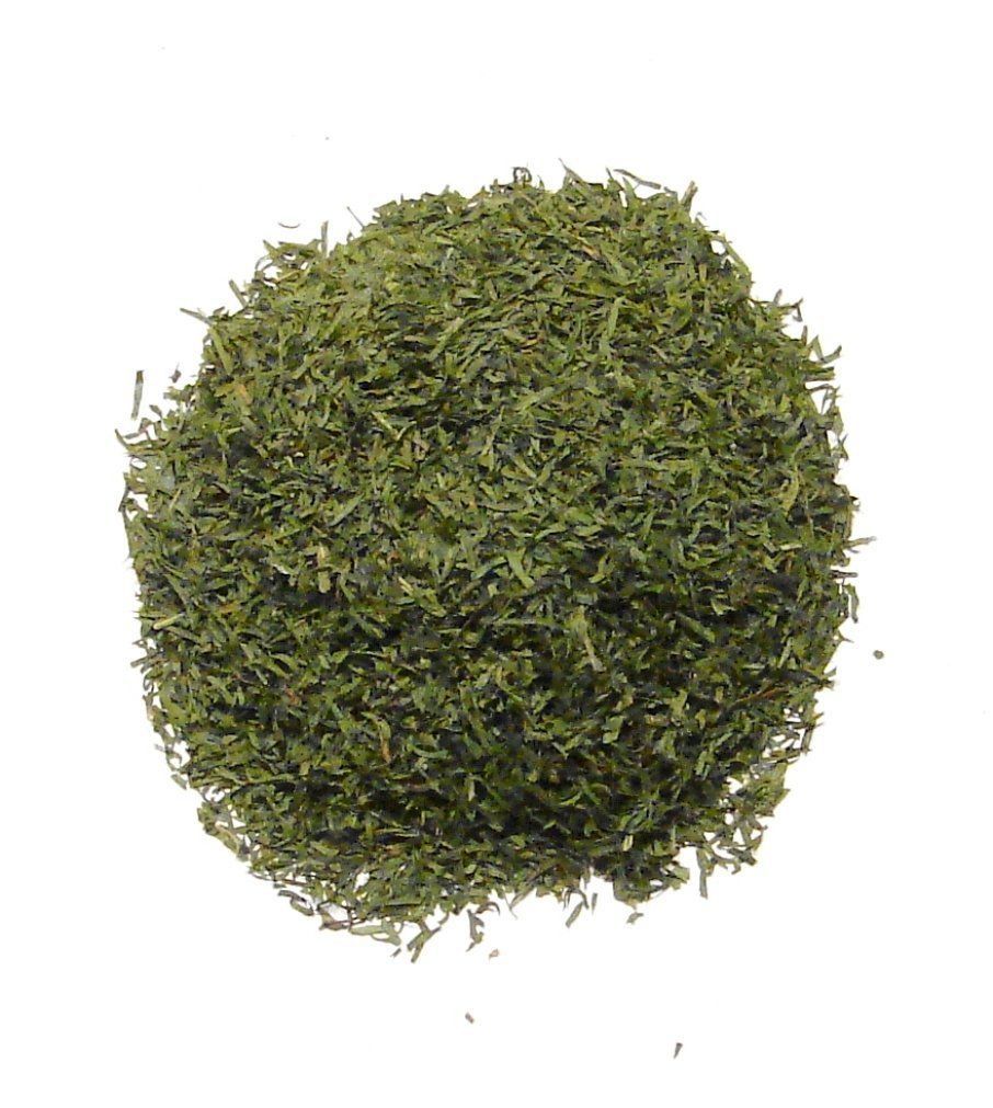 Pile of dried dill weed from Naveen Herbs on a white background