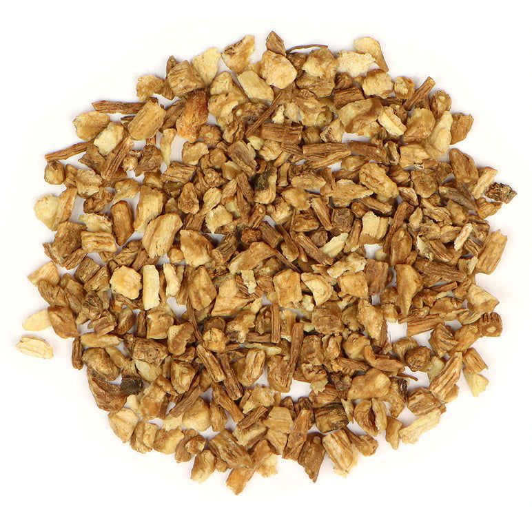 Pile of dried dong quai root from Naveen Herbs on a white background