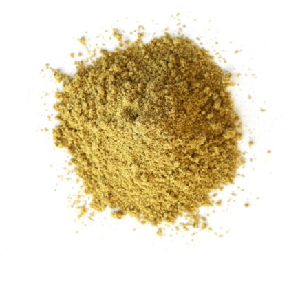 Pile of fennel seed powder on a white background
