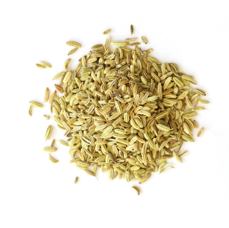 Pile of fennel seeds on a white background