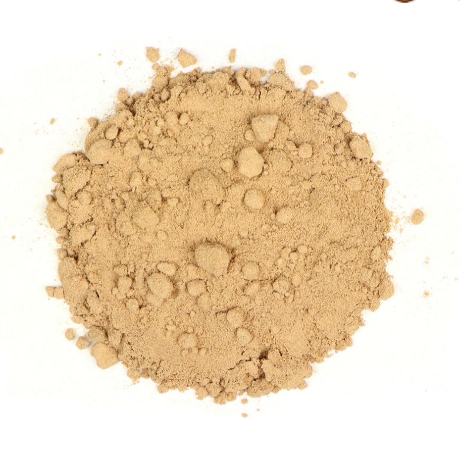 Pile of fine galangal root powder on a white background