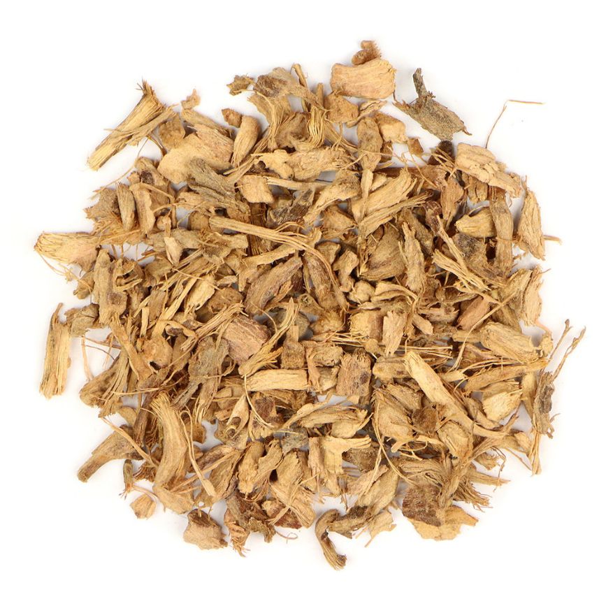 Pile of dried galangal root on a white background