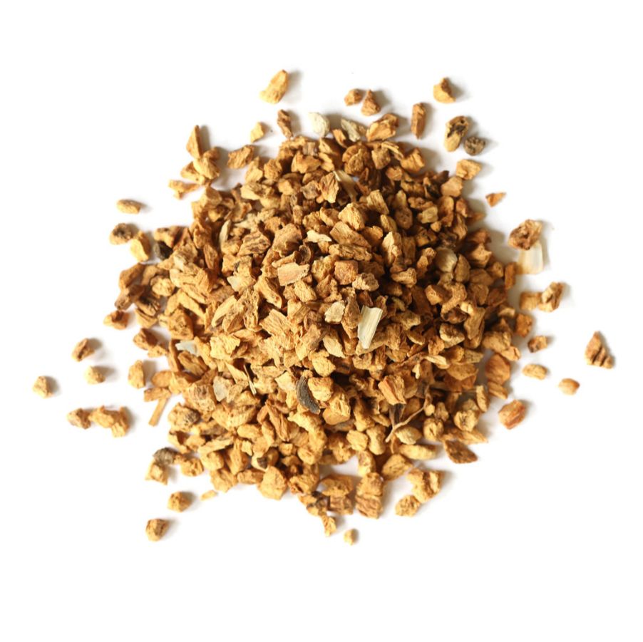 Pile of dried gentian root on a white background