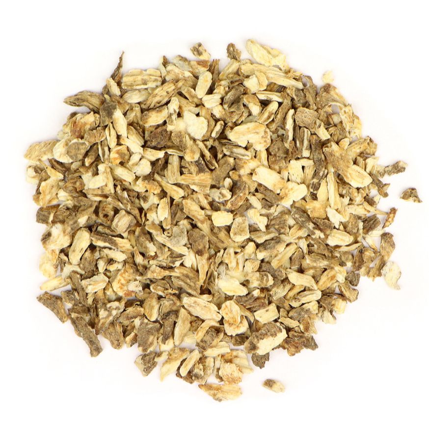 Pile of dried lovage root on a white background