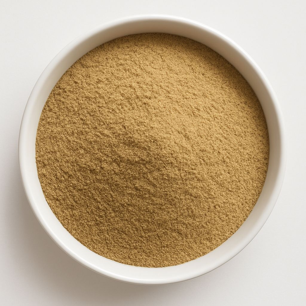 Pile of dandelion root powder from Naveen Herbs on a white background